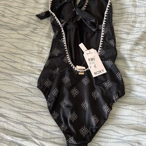 Roxy size M one piece swimsuit. Brand new with tags never worn.